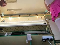 This 18-year-old brunette works extra cash gigs in white stockings, pearl thong, pink mini skirt, and goes braless.
