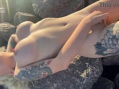 hey, this hot exhibitionist is teasing her clit wildly on a sunny public beach
