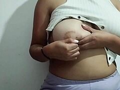 oh wow!! this milf's rubbing her big tits with such intense pleasure in a real homemade video!!!