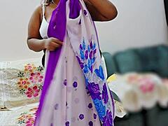 Indian bhabhi elegantly adjusts her traditional saree in a quiet moment