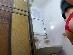 Athletic Latina chica takes a quick pee break in the public bathroom stall