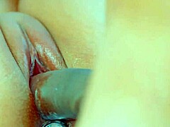close-up video shows perfect puffy pink pussy with buttplug