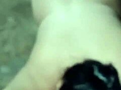 Wife licks friend's cock while husband watches in outdoor Brazilian scene.
