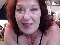 Curvy redhead with saggy tits contrasts her pale skin against big black cock while sucking and riding to orgasm