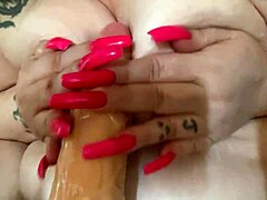 AriesBBW contrasts huge tits with sharp nails in fat dildo play