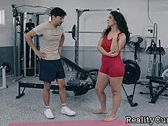 Curly Brunette with Juicy Ass Seduces Trainer for Wet Blowjob