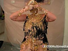 Two blondes get wet and messy while pieing each other in the face during a fun session