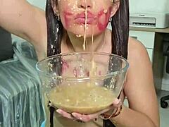 She casually grabs junk food in her pigtails and long hair, then ends up puking it all out.