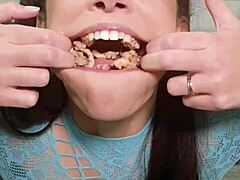 She casually grabs junk food in her pigtails and long hair, then ends up puking it all out.