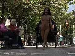 Hey, watch this naked babe pull a chariot outdoors!