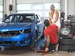 In the garage, the swanky woman with big tits rims her husband to relax him