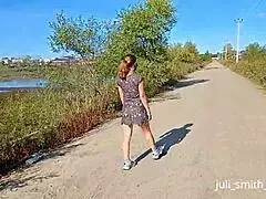 juli struts in a see-through dress flashing outdoors