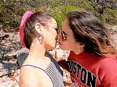 two best friends drink pee outdoors with big asses.