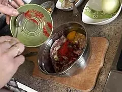 Sexy milf Frina cooks nude in stockings and high heels without panties