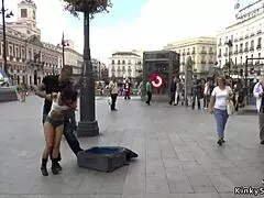 spinner dragged through public streets in suitcase