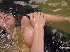 Sexy Charlotte Lewis performs handjob in 1988 retro threesome!