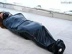 Asian Latex Lady Bound Tight in Sleeppack Fetish Play!