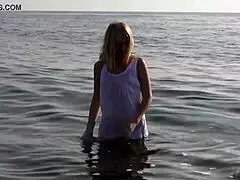 divine blonde teen strips naked by the sea, so hot!