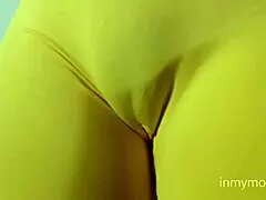 Stunning beauty teases in tight leggings with puffy cameltoe. She reveals her hairy pussy in bikini!