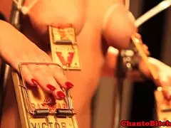 blonde sub bound with mousetraps in femdom domination