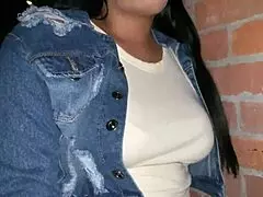 A woman masturbates privately in the parking lot.