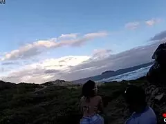 Novinha, are you sucking cock on the rocks by the sea?