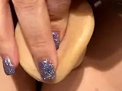 Laina Marie stuffs two dildos into her shaved pussy and cums hard.