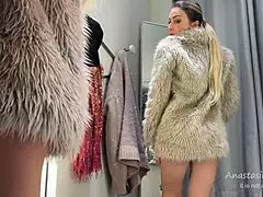 Cute slut flashes natural tits naked in public changing room