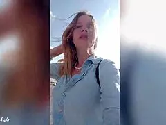 Blonde Woman Publicly Displays in Outdoor Setting