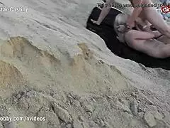 On mydirtyhobby a hot blonde babe sucks cock at a public beach watched by voyeurs