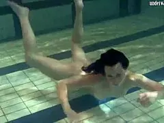 Fresh teen dives into a steamy underwater public show