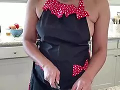 Kara prepares chicken wings in the kitchen