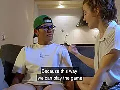 Classmates engage in adult games on the sofa, following dirty instructions from friends