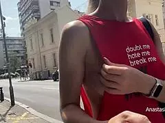 She walks braless in city flashing pierced nipples