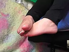 Pregnant Girl Receives Comforting Flip Flops in Bedroom with Close-Up on Barefoot Toes