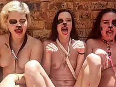 Three drooling topless sluts stick tongues out in outdoor spit fetish
