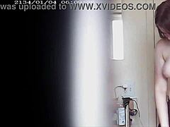 Blonde with big boobs caught changing in a voyeur moment