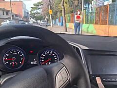 Driver seeks directions while stroking hard in the car for a public thrill.