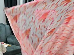 Indian bhabhi reveals her hot boobs in a tantalizing display of curves