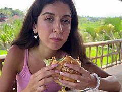 Cute brunette teen flashes small tits and gets cum on face after pov blowjob in public restaurant toilet