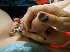 She gives a close-up POV handjob on 4th of July with dripping cum on pretty nails