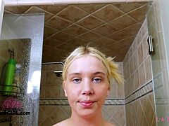 Aspiring teen model steps into the shower after her photoshoot session on the sofa