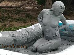 I'm covering myself in clay while sploshing in the pool