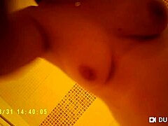 Spy camera captures nude tits in steamy shower scene