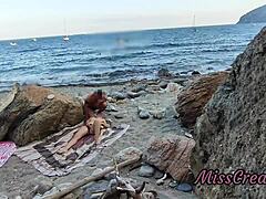 She flashes her pussy at a guy on the public beach. He helps her squirt in this risky hidden cam moment.