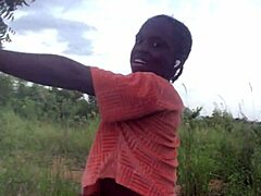 crazy woman twerking partially clothed in a dense forest setting