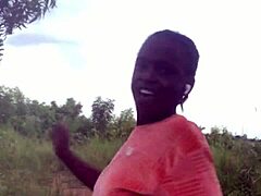 crazy woman twerking partially clothed in a dense forest setting