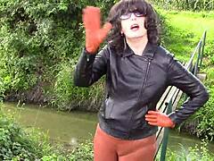 milf wife in glasses smokes fetish while wearing tight leather gloves outdoors