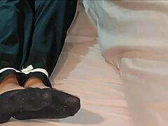 Korean babe ties self up tight in socks before nap time