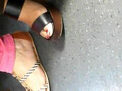 mature feet hidden in candid wedge sandals tease secretly